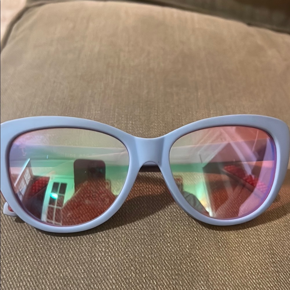 Goodr light blue sunglasses with pink polarized lenses
